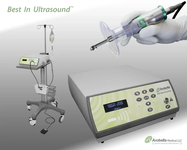 MIST Ultrasound unit for wound care with a close up of the device and a gloved hand using the treatment wand.