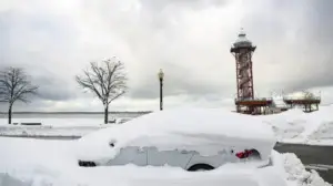 winter wound care awareness via a white snow covered car parked in downtown erie pa