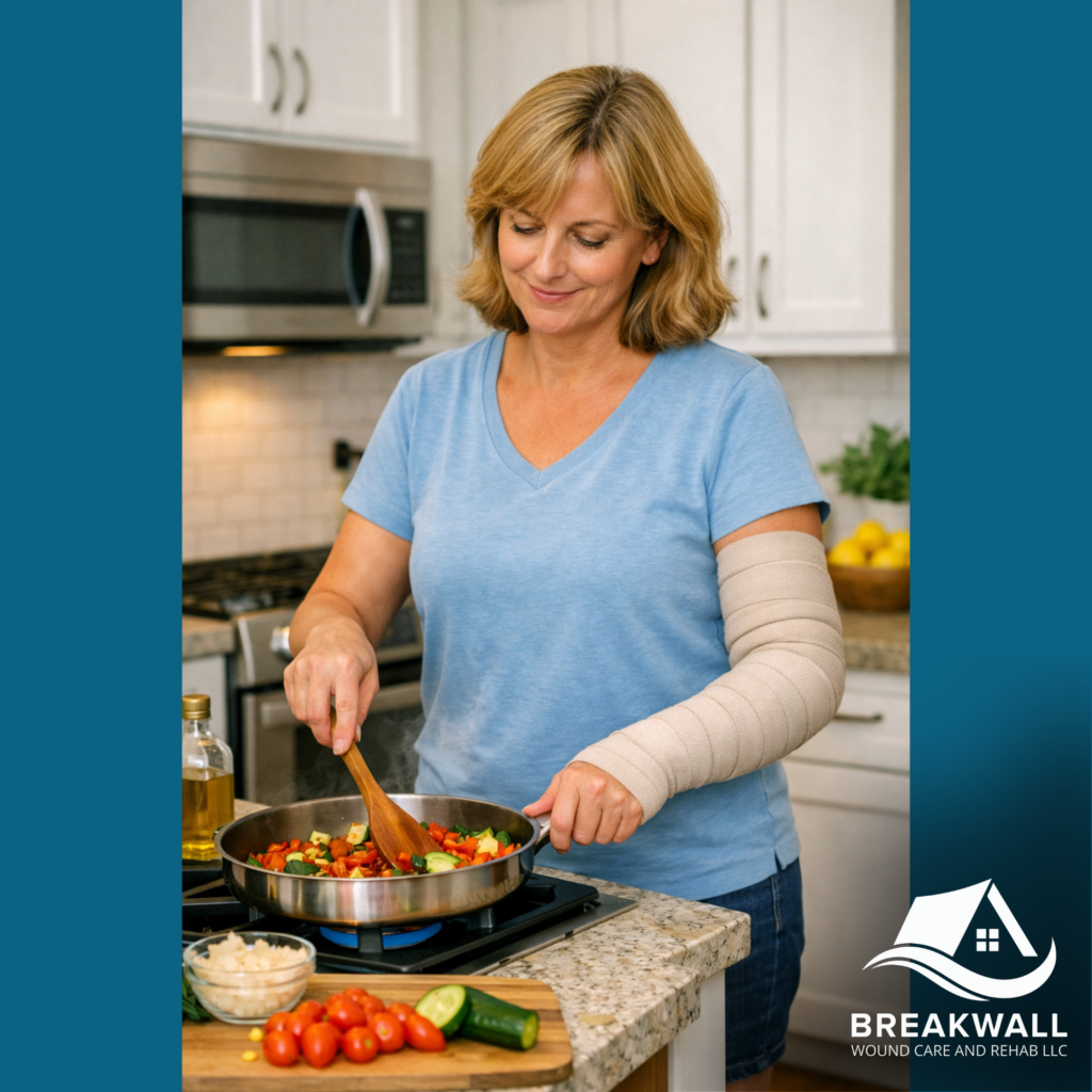 A women with left arm lymphedema stands cooking at the stove with her left arm wrapped for lymphedema compressive therapy via breakwall wound care and rehab in erie pa.
